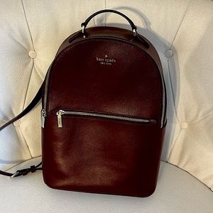 Kate Spade backpack in deep maroon leather. Interior pocket for laptop or iPad.